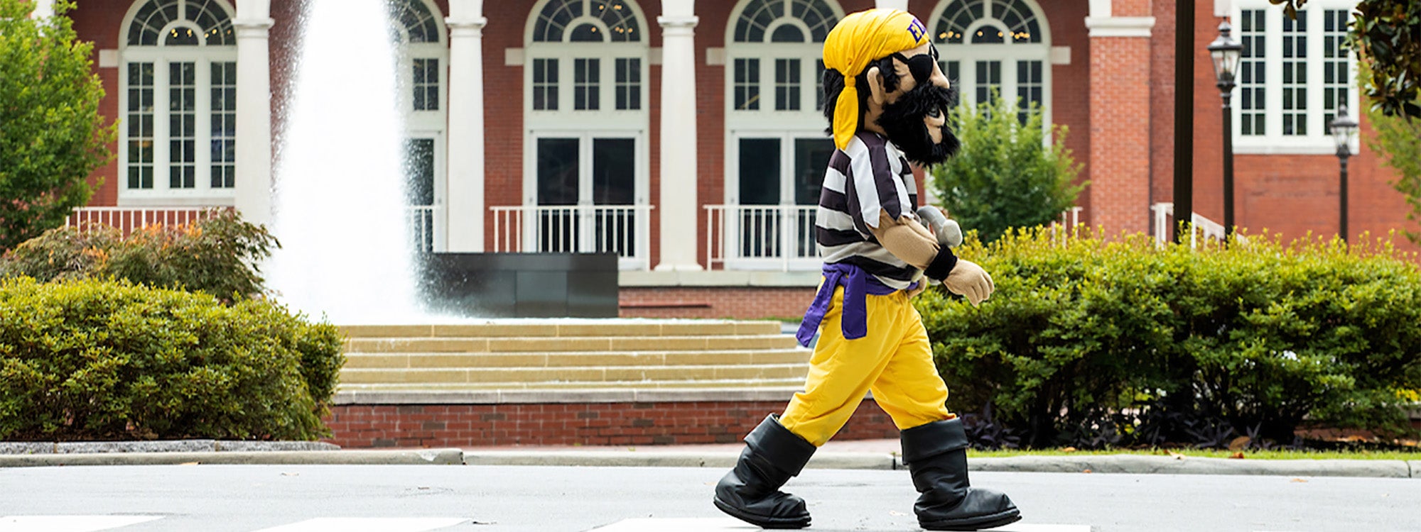 PeeDee walks by Wright Fountain